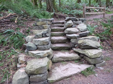 Boomer Trail has stone steps and street crossing with crosswalk on trail loop